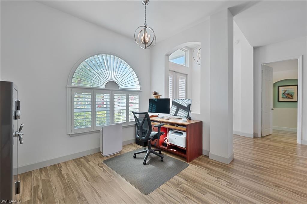 3213 Brookeview Court Naples, FL 34120 - Photo 11 of 31 a view of a livingroom with workspace and a window