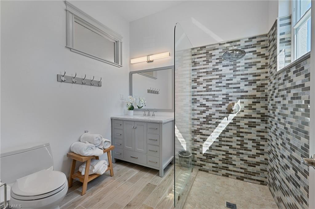 3213 Brookeview Court Naples, FL 34120 - Photo 16 of 31 a bathroom with a toilet and a shower