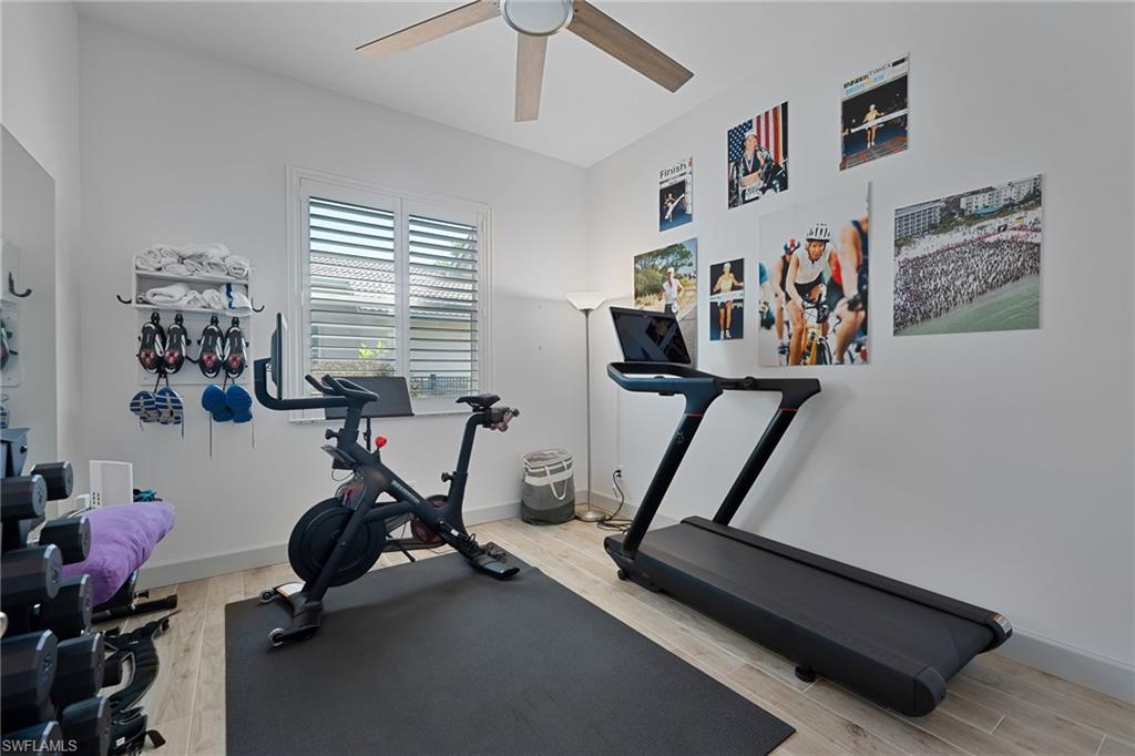 3213 Brookeview Court Naples, FL 34120 - Photo 17 of 31 a view of a room with gym equipment