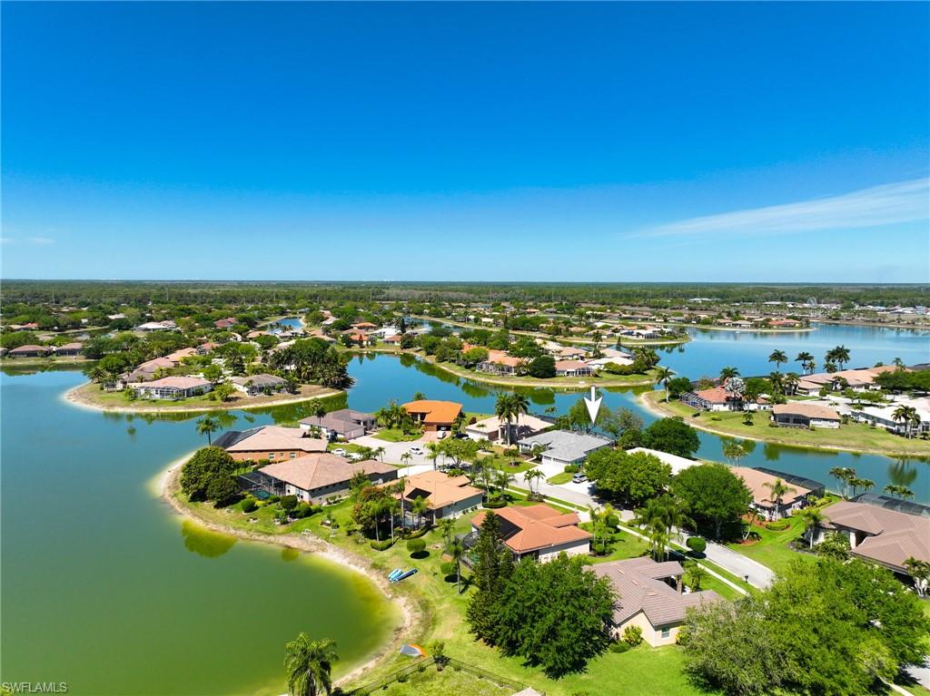 3213 Brookeview Court Naples, FL 34120 - Photo 2 of 31 an aerial view of residential houses with outdoor space