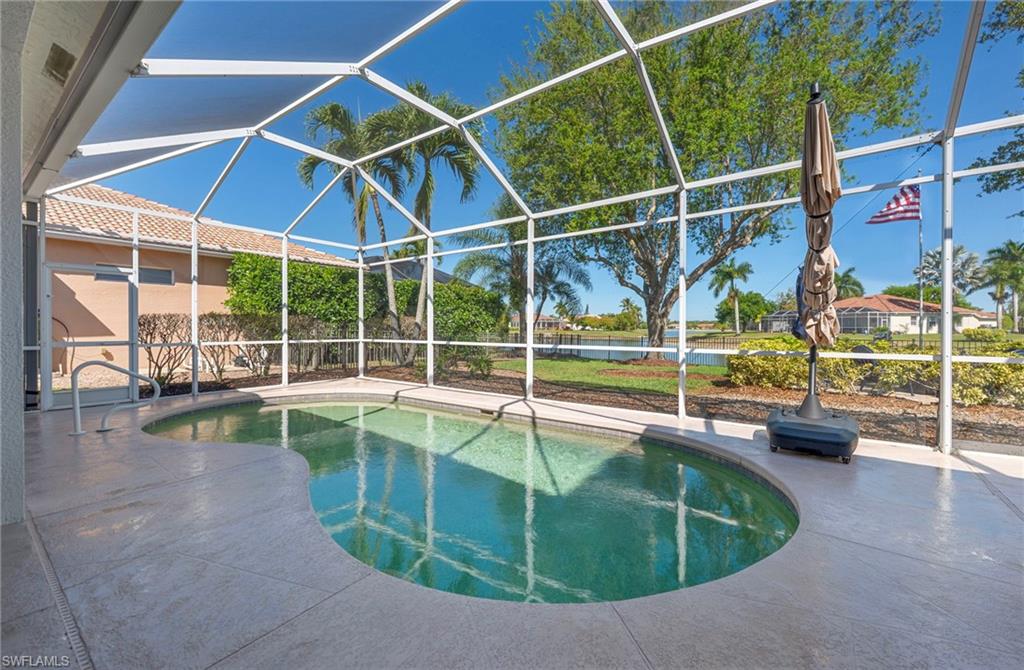 3213 Brookeview Court Naples, FL 34120 - Photo 21 of 31 a view of a swimming pool with a patio