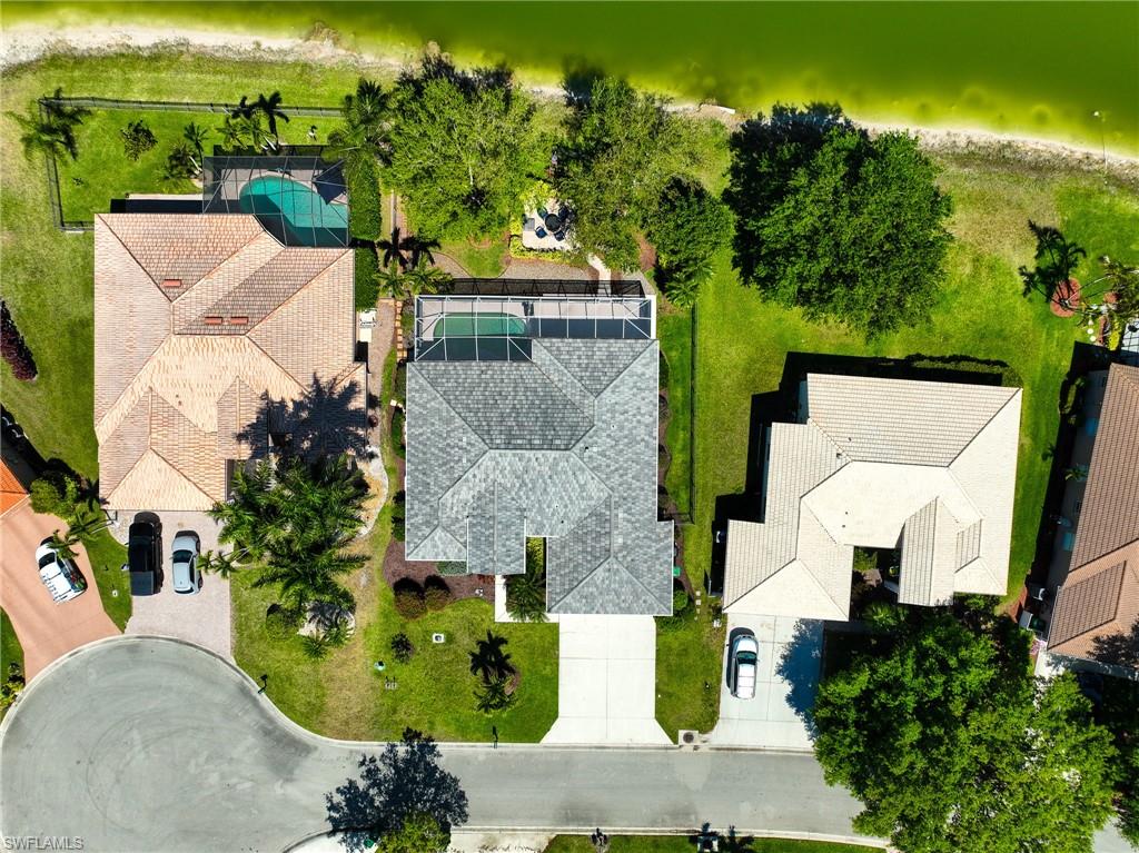 3213 Brookeview Court Naples, FL 34120 - Photo 23 of 31 an aerial view of a house with yard