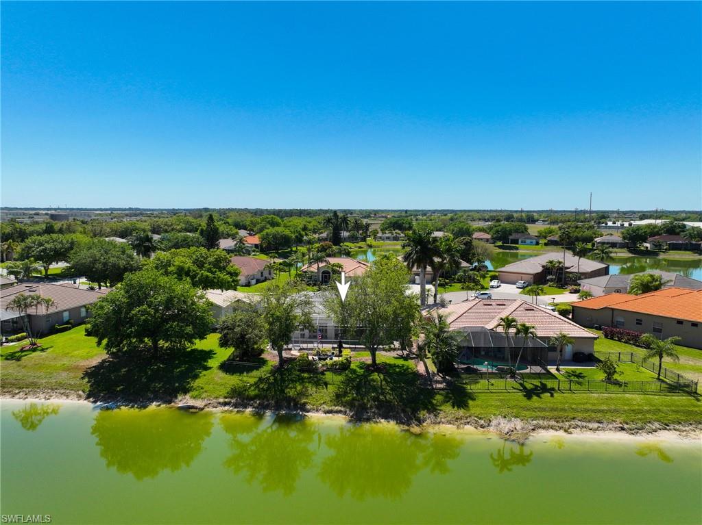 3213 Brookeview Court Naples, FL 34120 - Photo 24 of 31 a view of residential houses with outdoor space and swimming