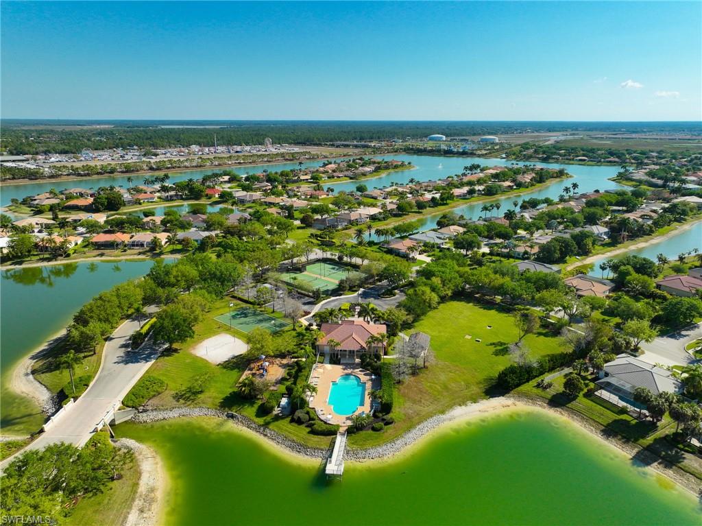 3213 Brookeview Court Naples, FL 34120 - Photo 26 of 31 an aerial view of residential houses with outdoor space and trees