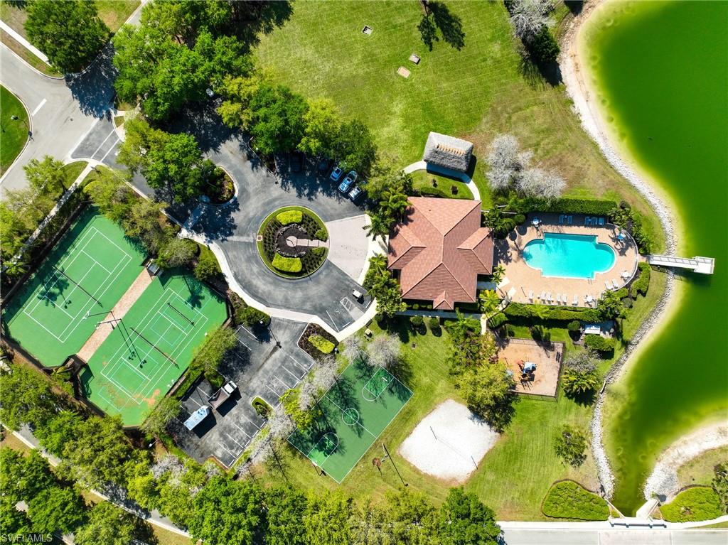 3213 Brookeview Court Naples, FL 34120 - Photo 27 of 31 an aerial view of a house with a garden and swimming pool