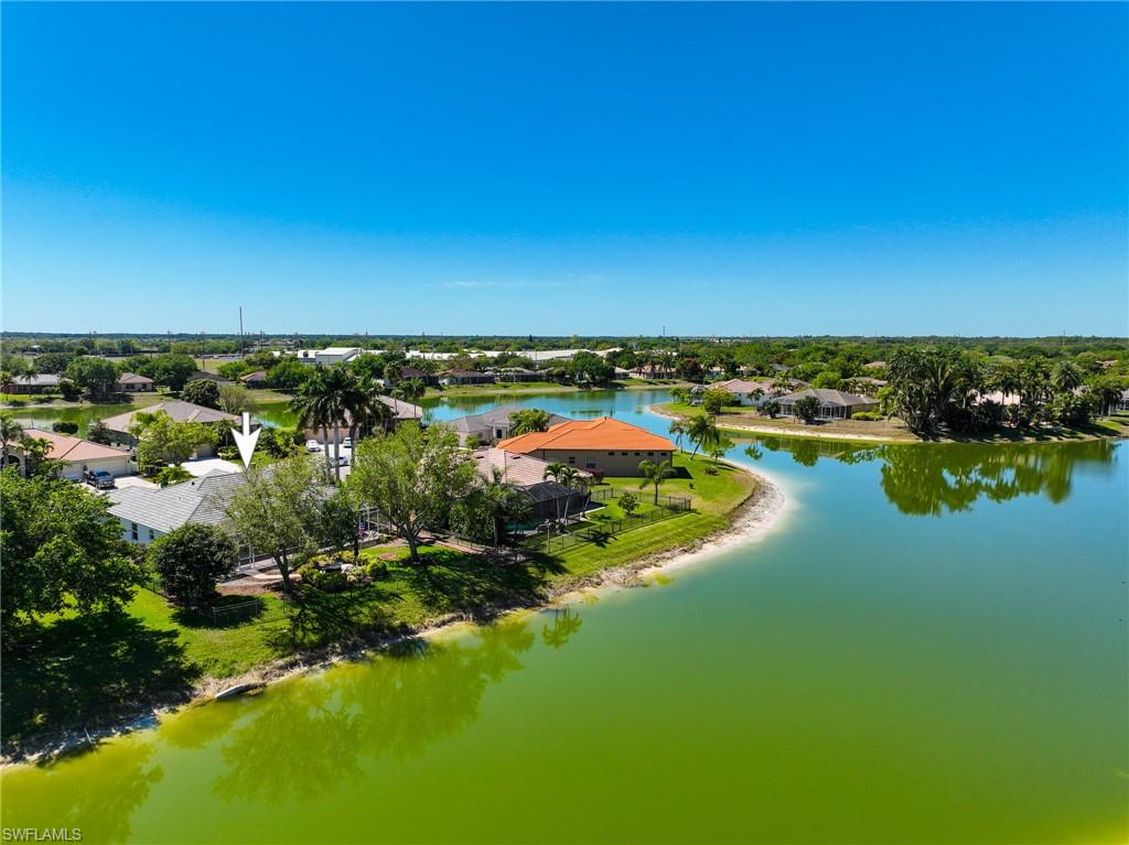 3213 Brookeview Court Naples, FL 34120 - Photo 3 of 31 a view of a lake with houses