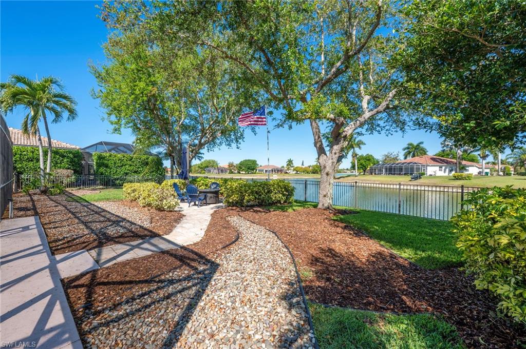 3213 Brookeview Court Naples, FL 34120 - Photo 6 of 31 a view of backyard with seating area and green space