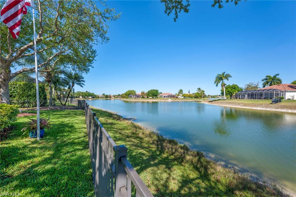 3213 Brookeview Court Naples, FL 34120 - Photo 7 of 31 a view of a lake with a yard