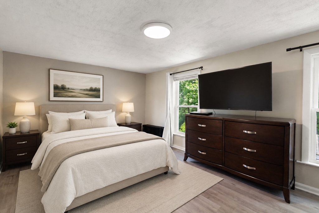13 Highland Road Middleton, MA 01949 - Photo 27 of 29 a bedroom with a bed and a flat screen tv