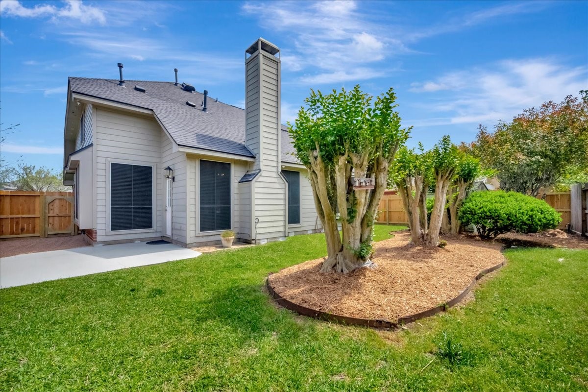 14010 Hazel Ridge Court Houston, TX 77062 - Photo 2 of 38 Lovely relaxing back yard. Freshly landscaped; patio recently painted, new CEDAR fencing, 2 new cedar gates.