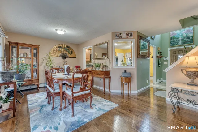 a kitchen with stainless steel appliances granite countertop a refrigerator stove and sink