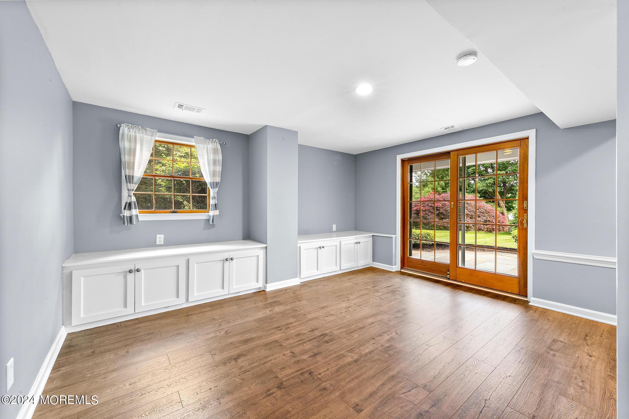 27 Ivy Hill Road Red Bank, NJ 07701 - Photo 15 of 55 a view of an empty room with a window and wooden floor
