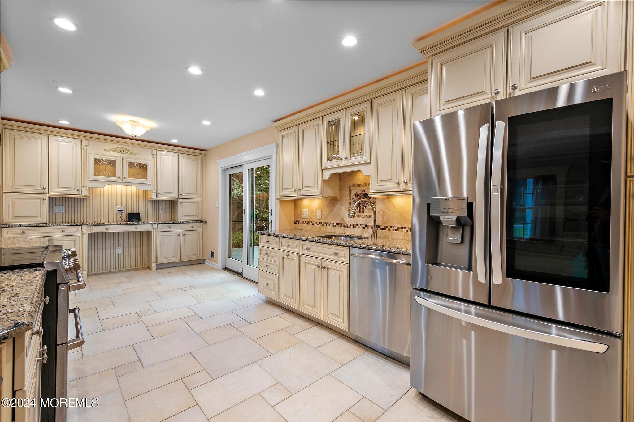 27 Ivy Hill Road Red Bank, NJ 07701 - Photo 21 of 55 a kitchen with stainless steel appliances granite countertop a refrigerator and a stove top oven