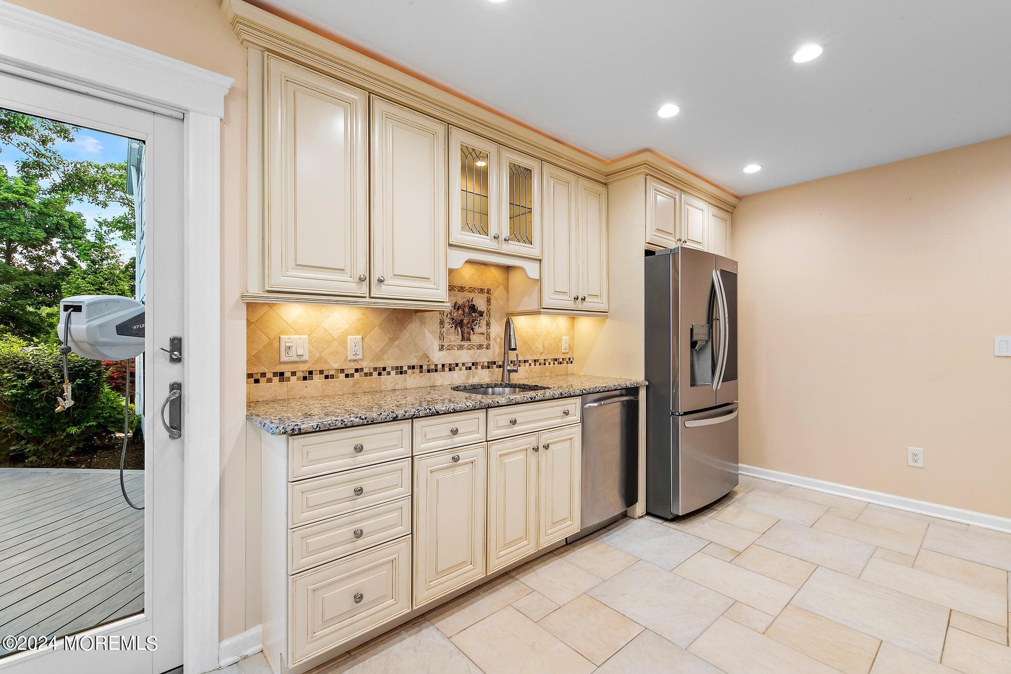 27 Ivy Hill Road Red Bank, NJ 07701 - Photo 23 of 55 a kitchen with granite countertop cabinets and refrigerator