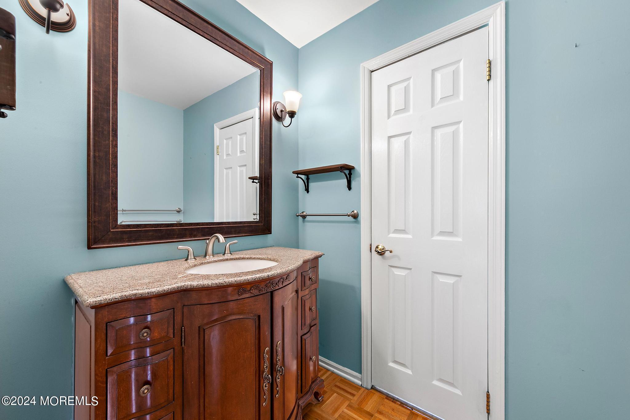 27 Ivy Hill Road Red Bank, NJ 07701 - Photo 31 of 55 a bathroom with a sink and a mirror