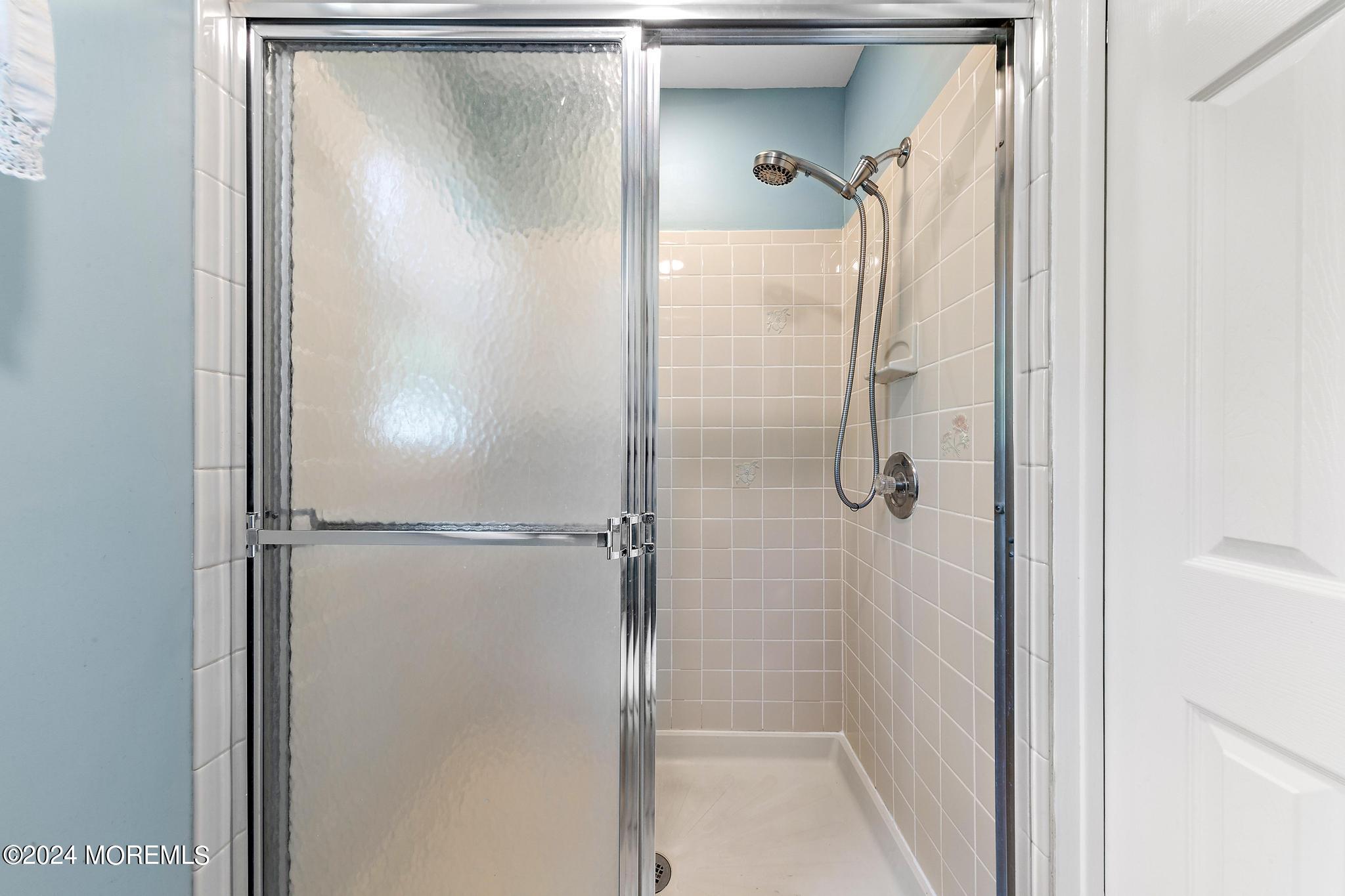 27 Ivy Hill Road Red Bank, NJ 07701 - Photo 32 of 55 a bathroom with a glass shower door