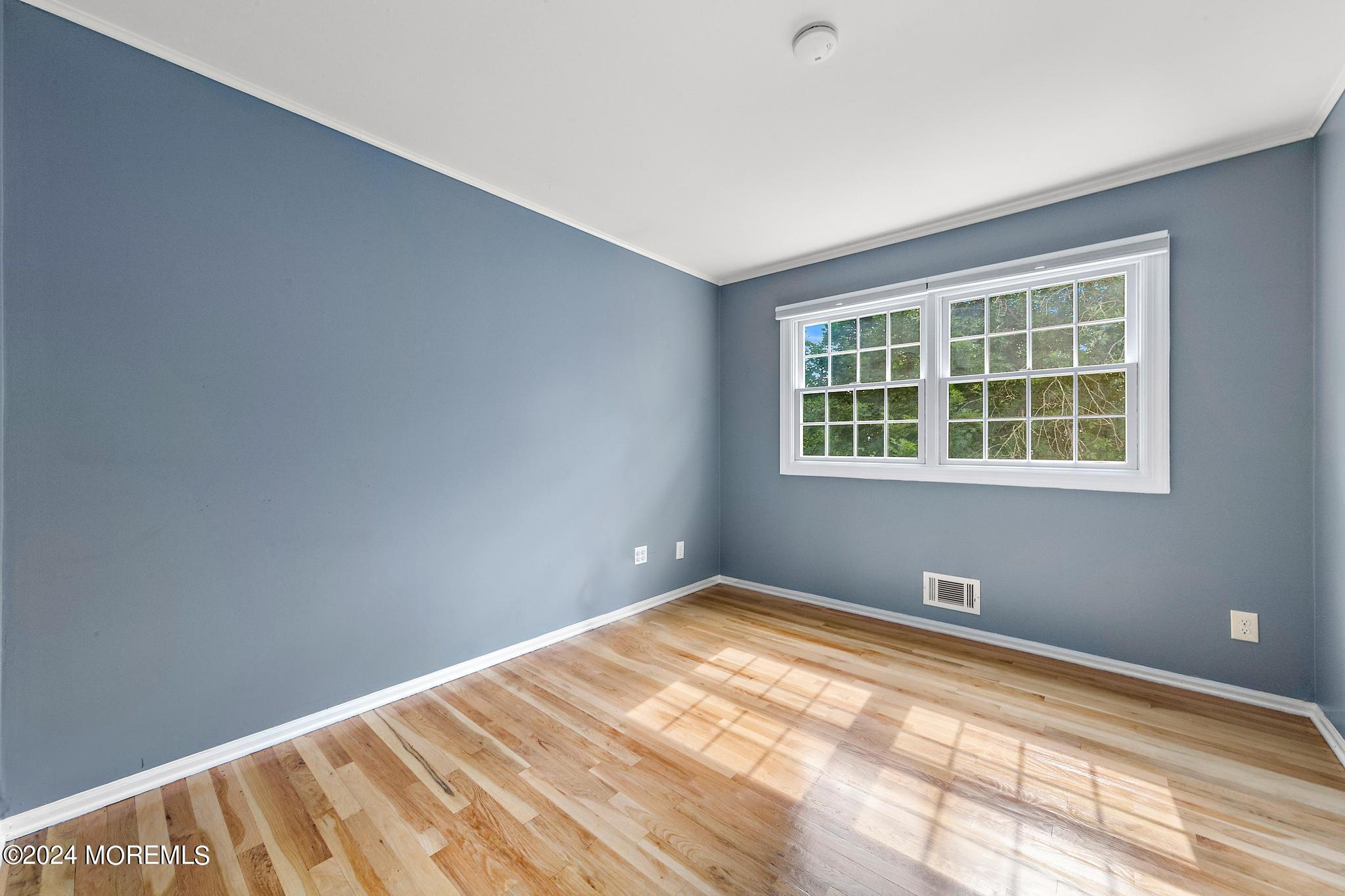 27 Ivy Hill Road Red Bank, NJ 07701 - Photo 38 of 55 a view of empty room with wooden floor
