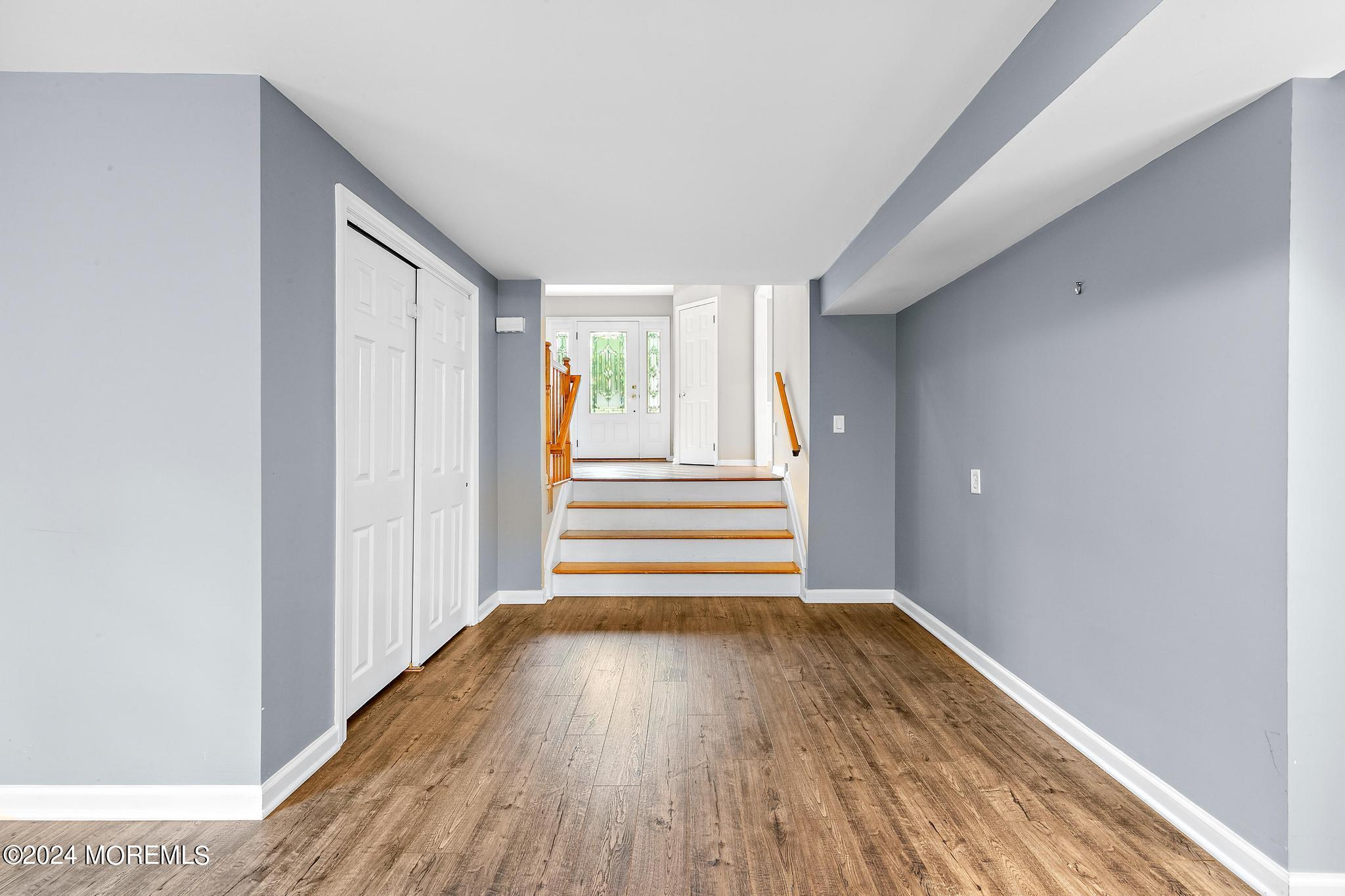 27 Ivy Hill Road Red Bank, NJ 07701 - Photo 9 of 55 a view of empty room with wooden floor and fan