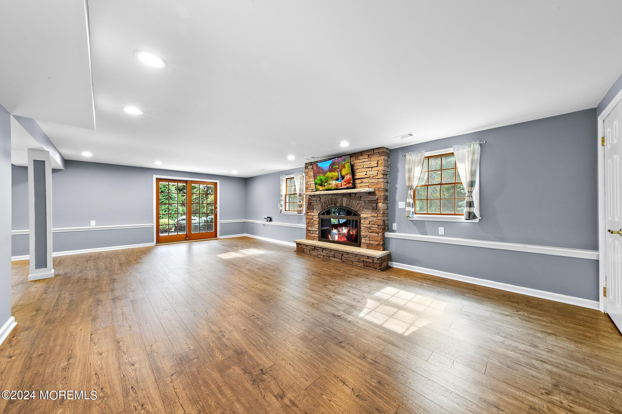 27 Ivy Hill Road Red Bank, NJ 07701 - Photo 10 of 55 a view of empty room with fireplace and wooden floor