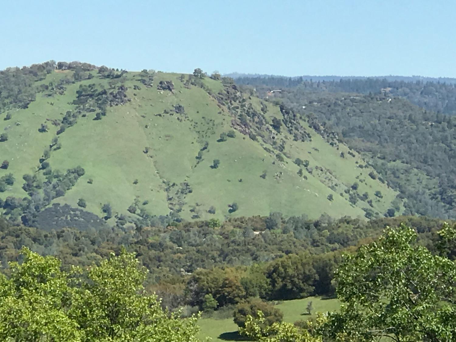 5080 Thompson Hill Road Placerville, CA 95667 - Photo 29 of 37 an aerial view of mountain with trees in the background