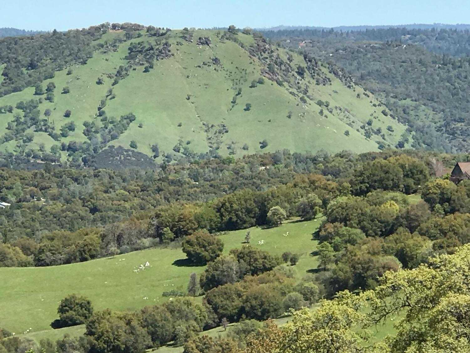 5080 Thompson Hill Road Placerville, CA 95667 - Photo 6 of 37 an aerial view of mountain with trees all around