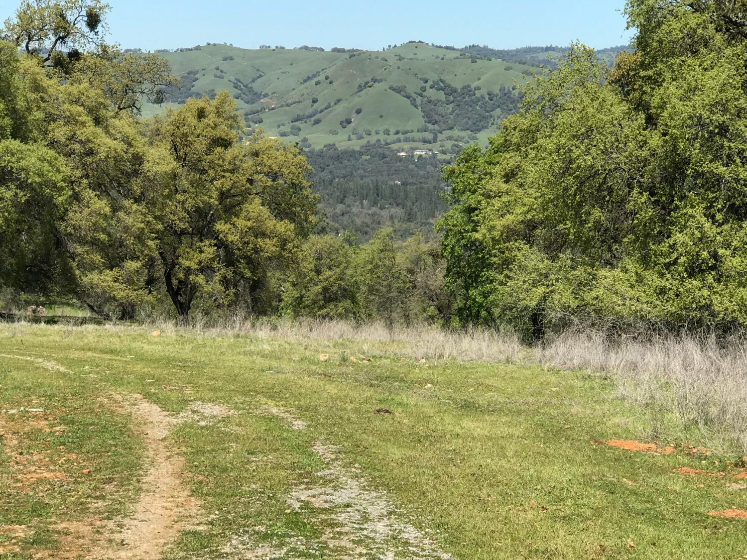 5080 Thompson Hill Road Placerville, CA 95667 - Photo 8 of 37 a view of a lake with a mountain