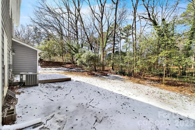 a view of a backyard of the house