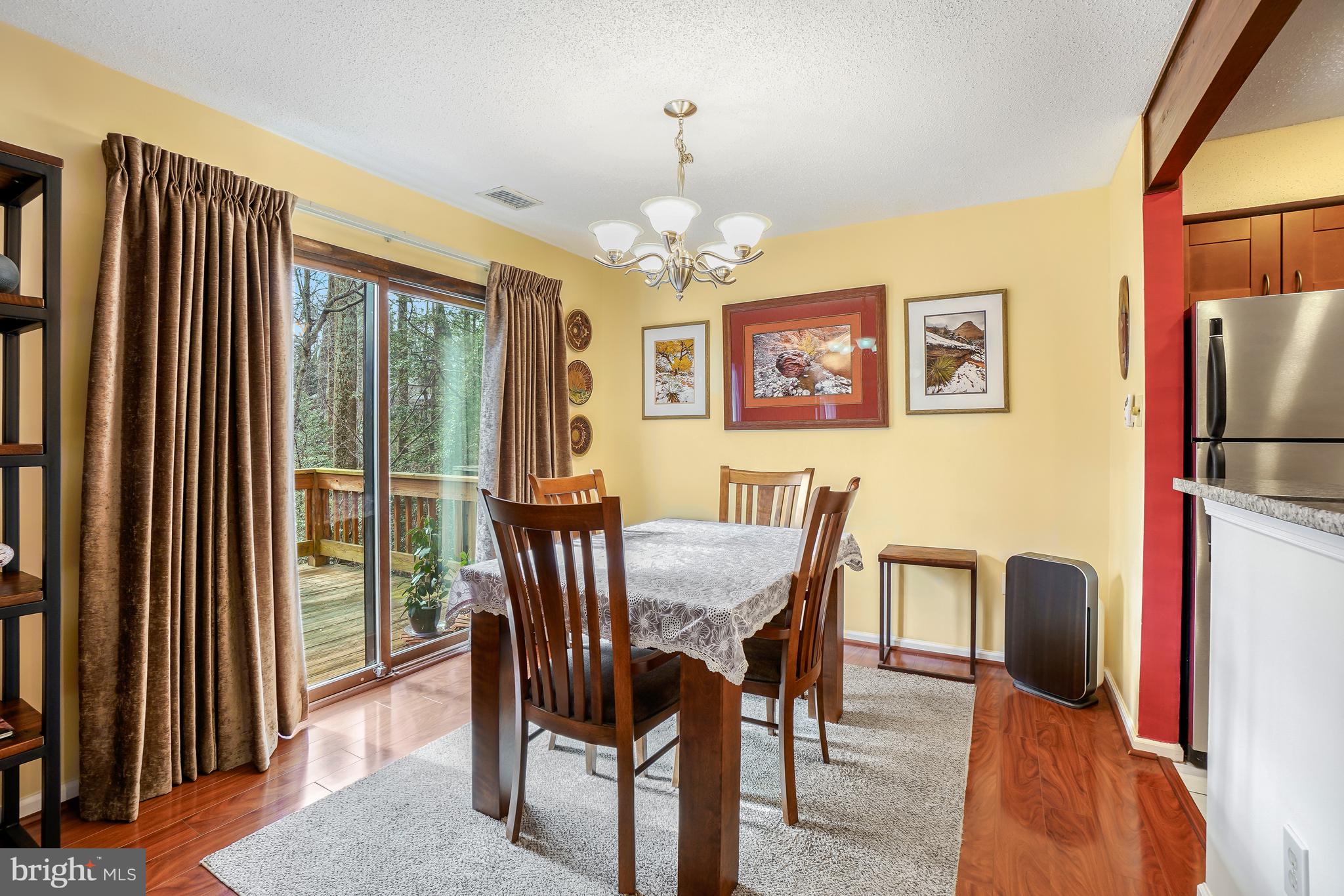 2315 Glade Bank Way Reston, VA 20191 - Photo 11 of 52 a view of a dining room with furniture window and outside view