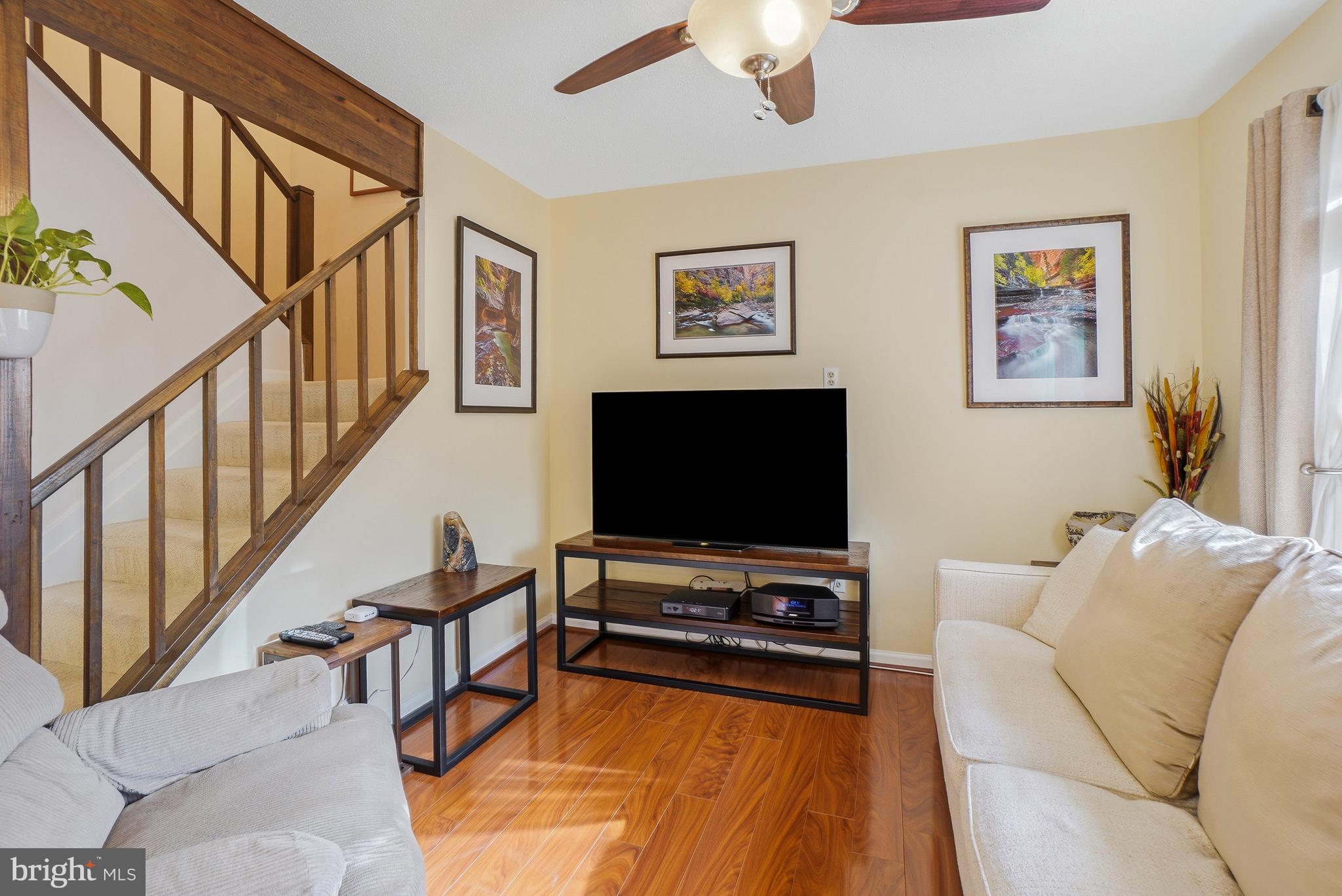 2315 Glade Bank Way Reston, VA 20191 - Photo 15 of 52 a living room with furniture and a flat screen tv