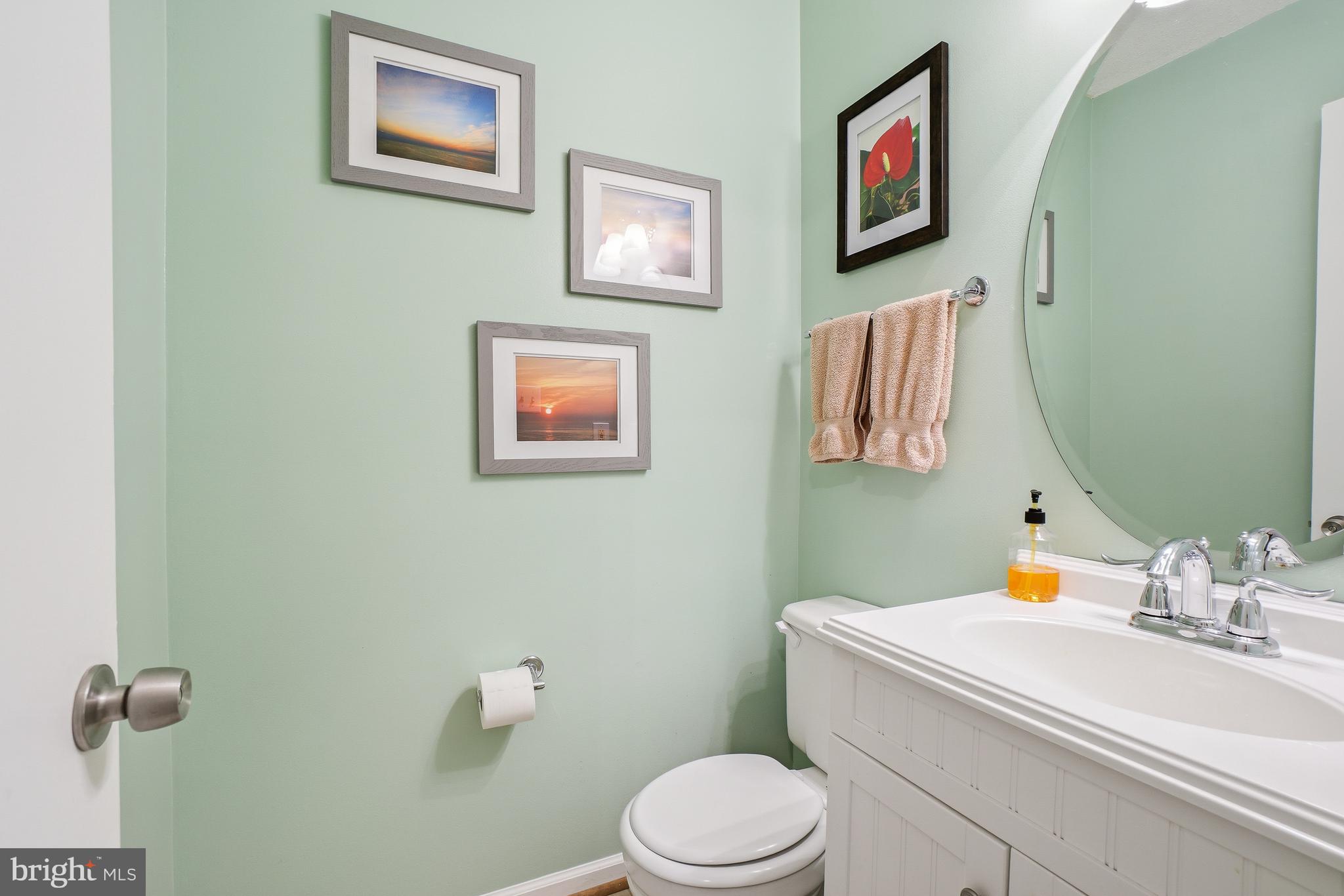 2315 Glade Bank Way Reston, VA 20191 - Photo 20 of 52 a bathroom with a sink mirror vanity and toilet