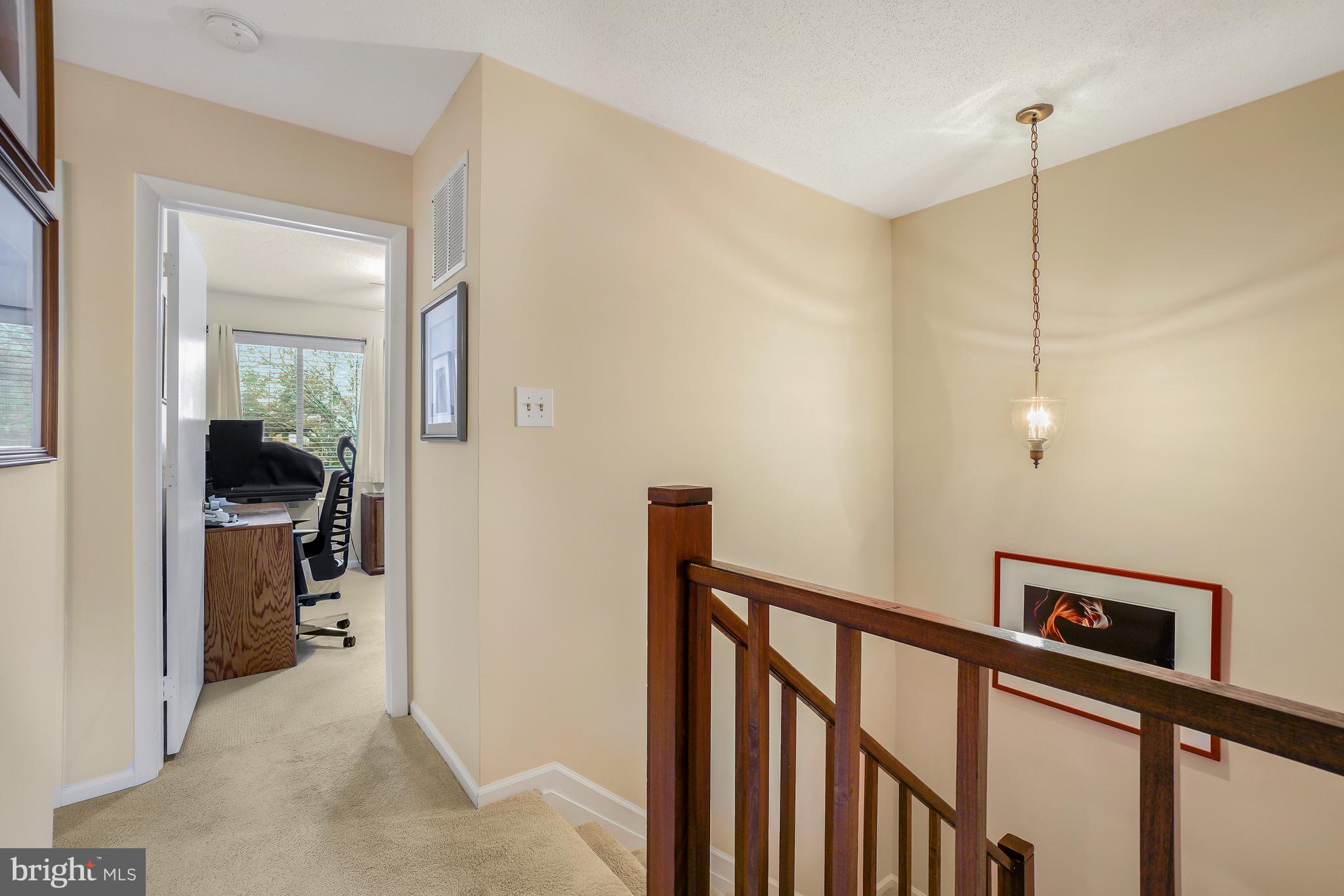 2315 Glade Bank Way Reston, VA 20191 - Photo 21 of 52 a view of a hallway with closet and a livingroom view