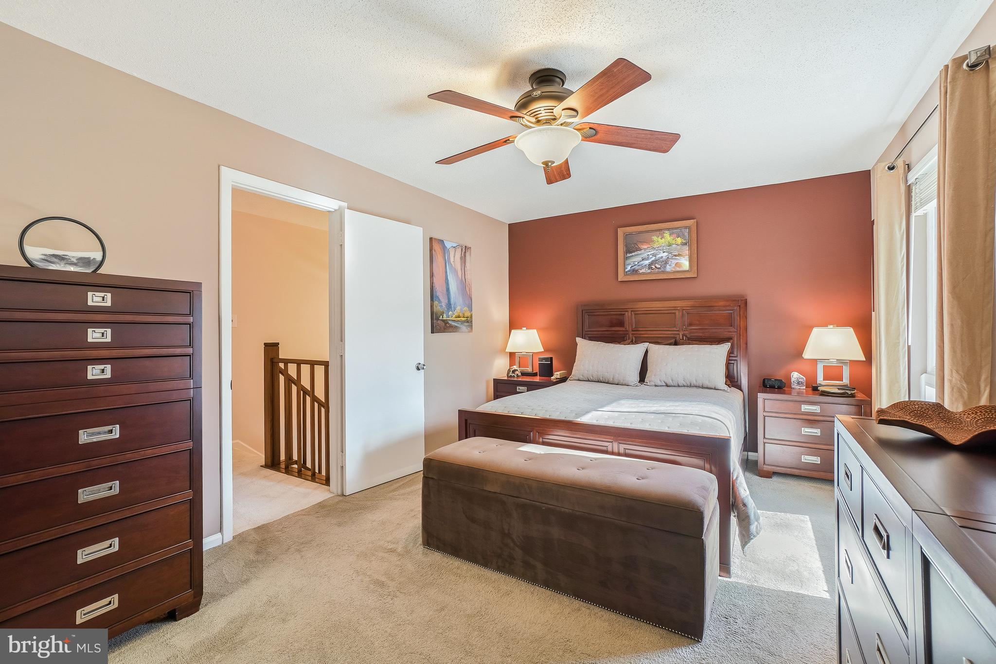 2315 Glade Bank Way Reston, VA 20191 - Photo 24 of 52 a bedroom with a bed and a chandelier