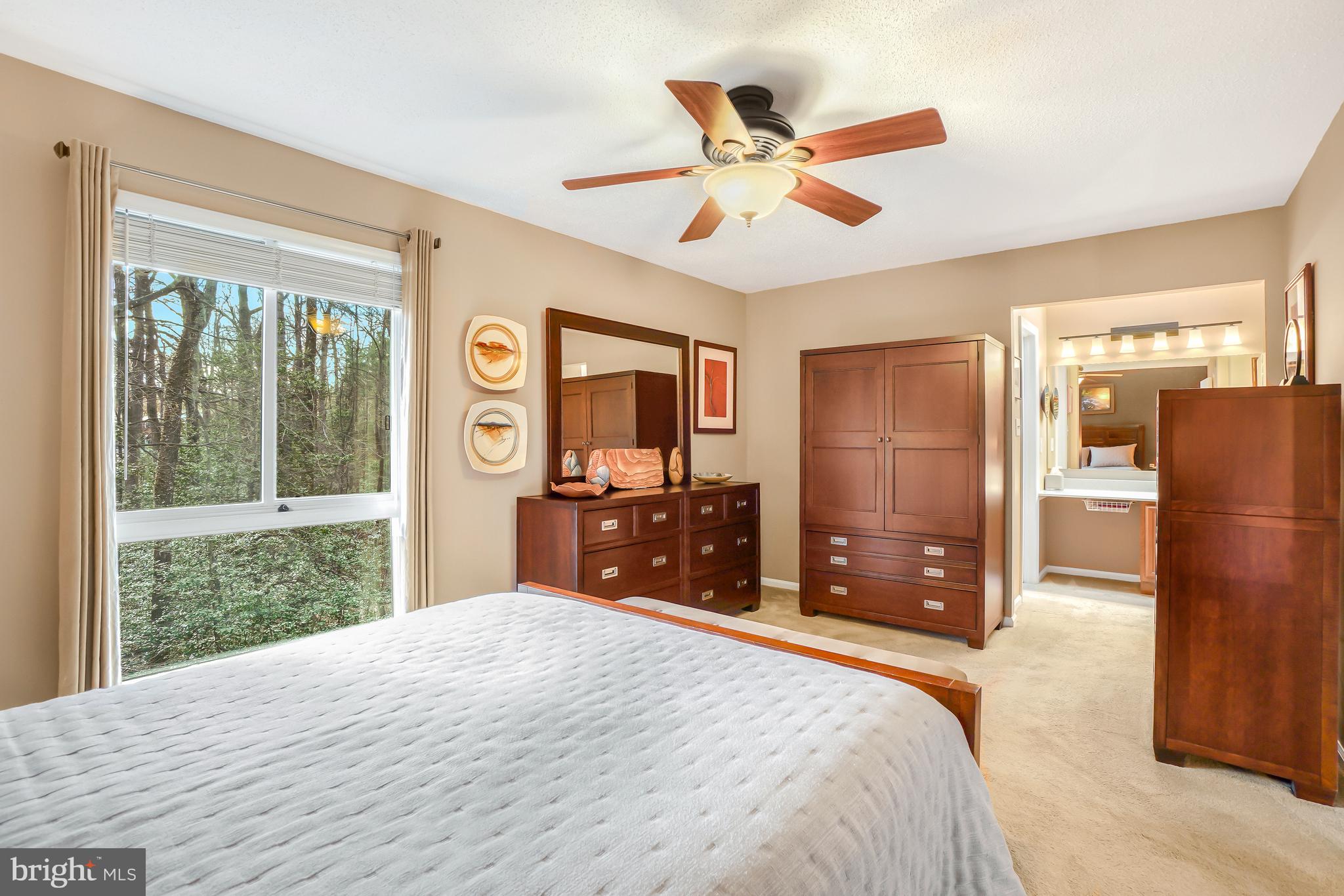 2315 Glade Bank Way Reston, VA 20191 - Photo 25 of 52 a bedroom with a bed dresser and a large window