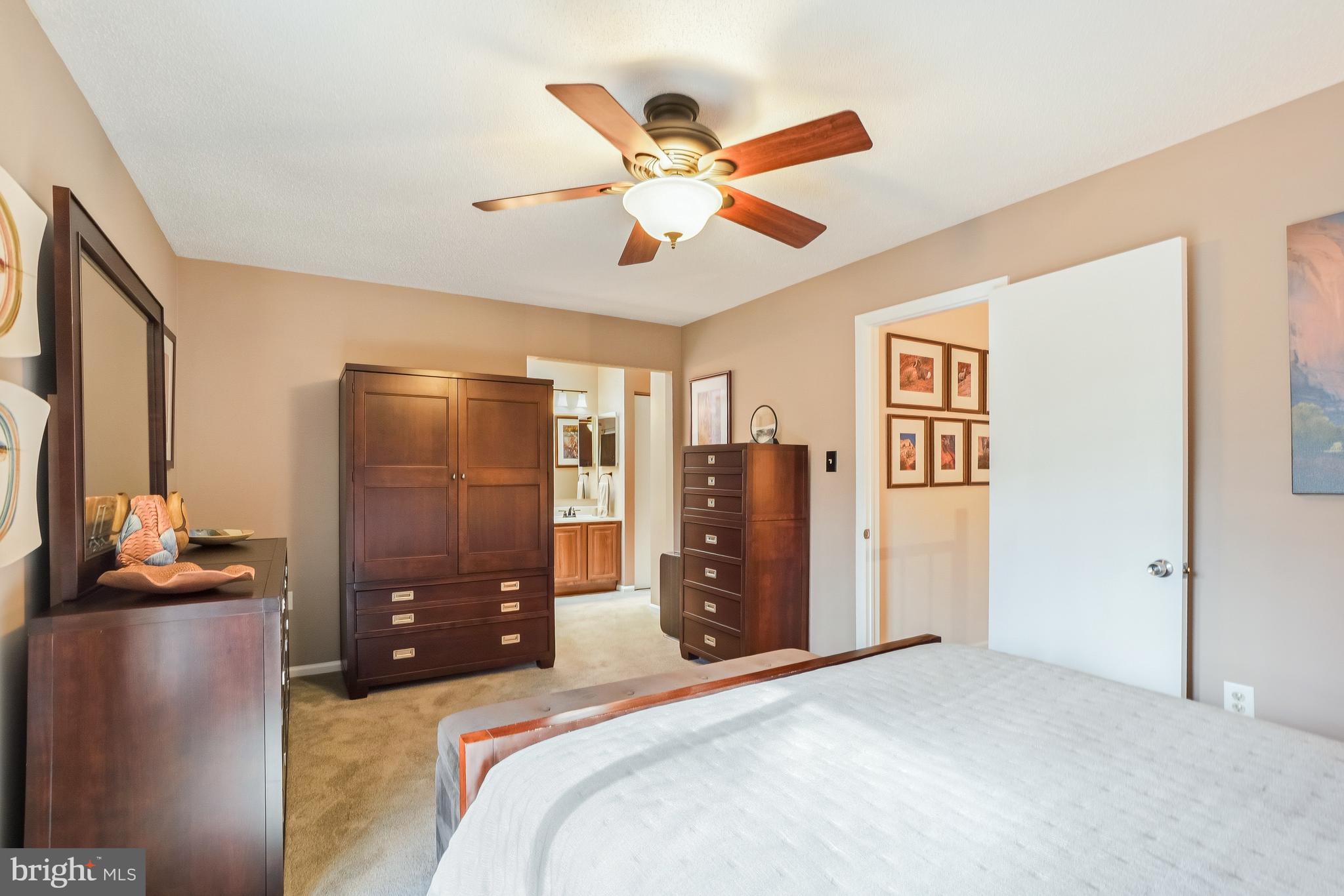 2315 Glade Bank Way Reston, VA 20191 - Photo 26 of 52 a bed room with a bed and a ceiling fan