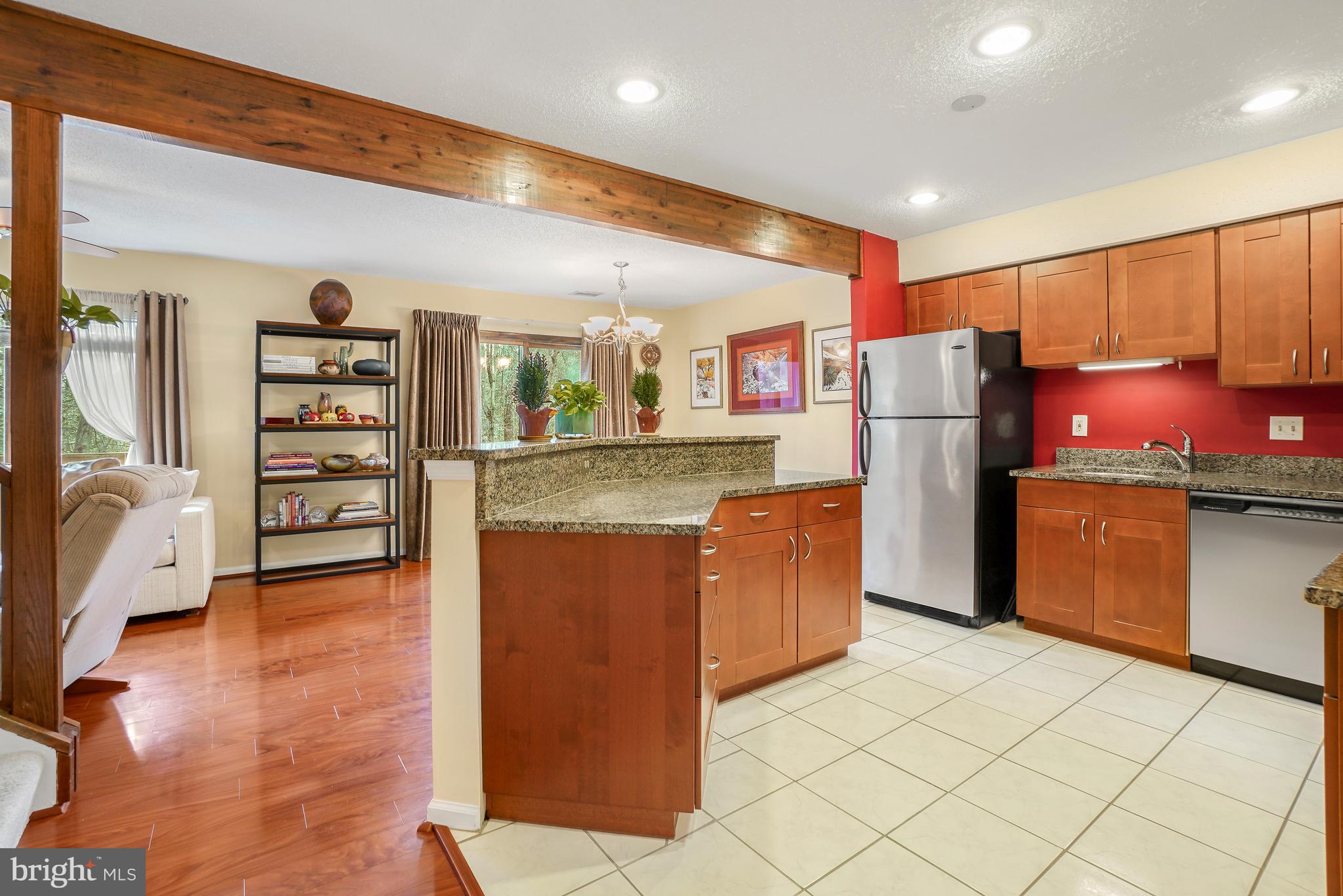 2315 Glade Bank Way Reston, VA 20191 - Photo 3 of 52 a kitchen with refrigerator cabinets and wooden floor
