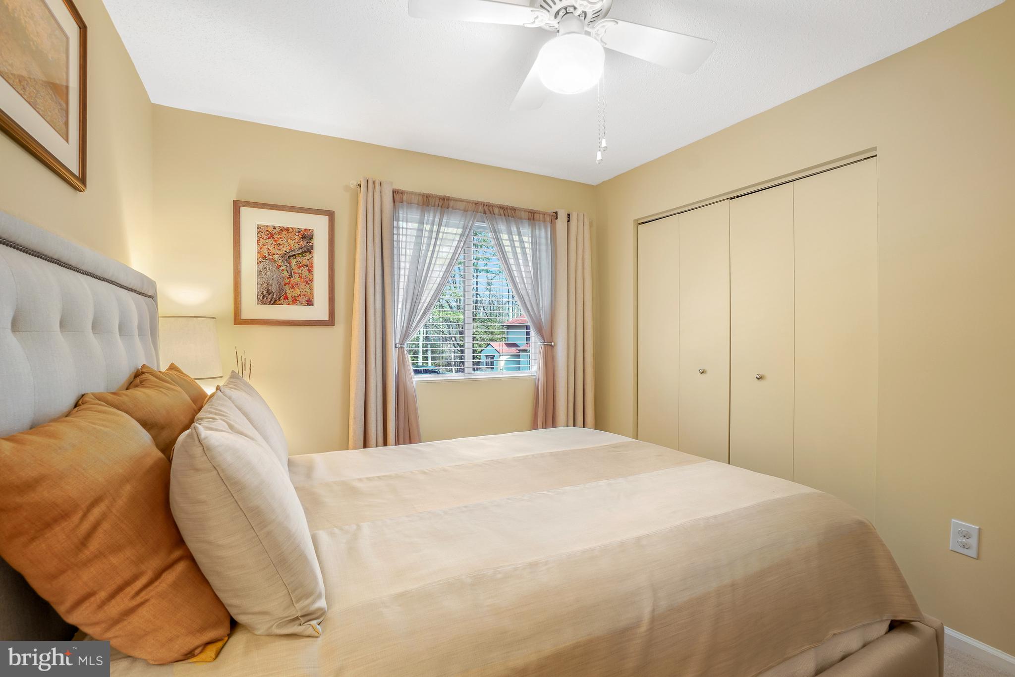 2315 Glade Bank Way Reston, VA 20191 - Photo 32 of 52 a bedroom with a bed and a chandelier