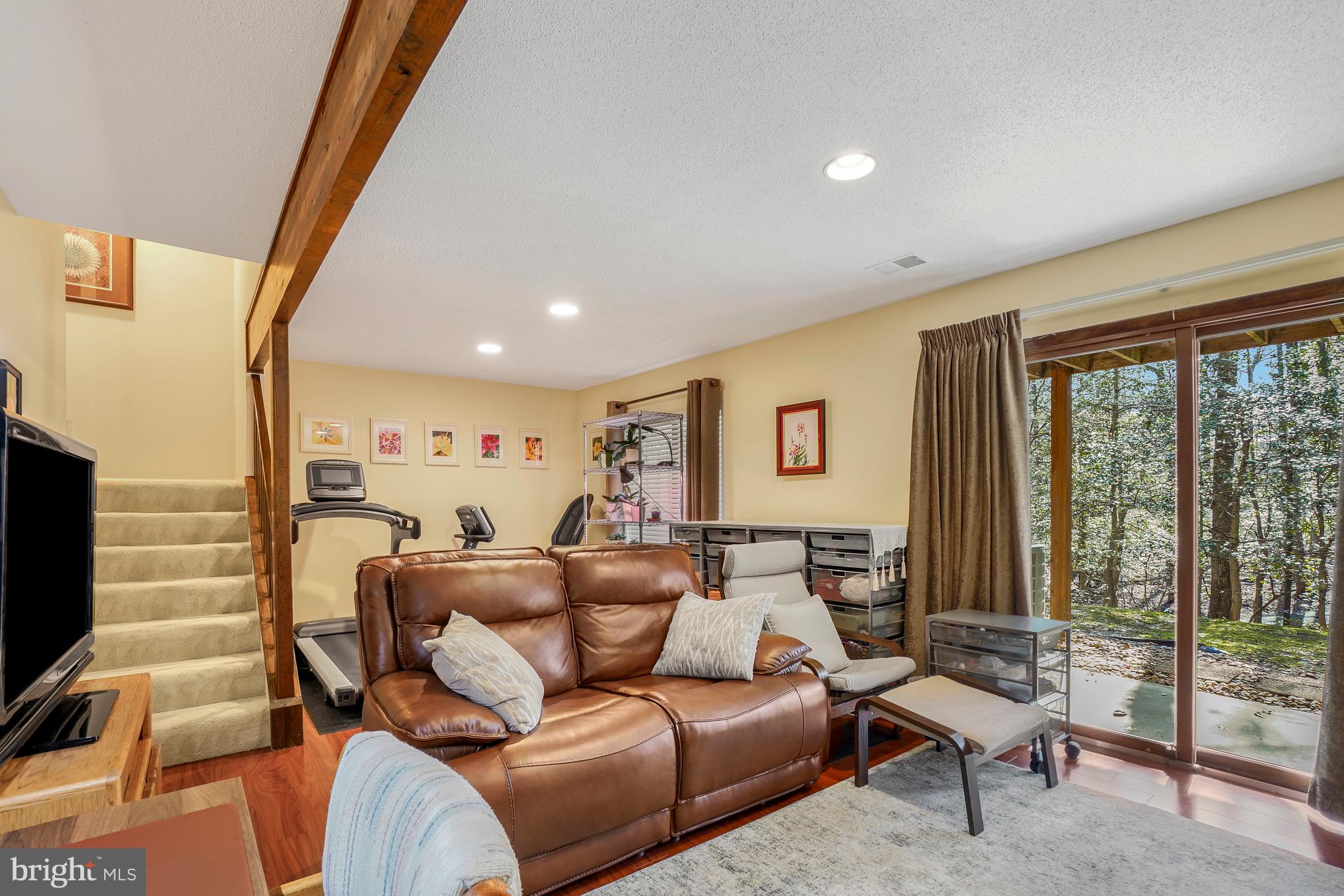 2315 Glade Bank Way Reston, VA 20191 - Photo 36 of 52 a living room with furniture and a flat screen tv