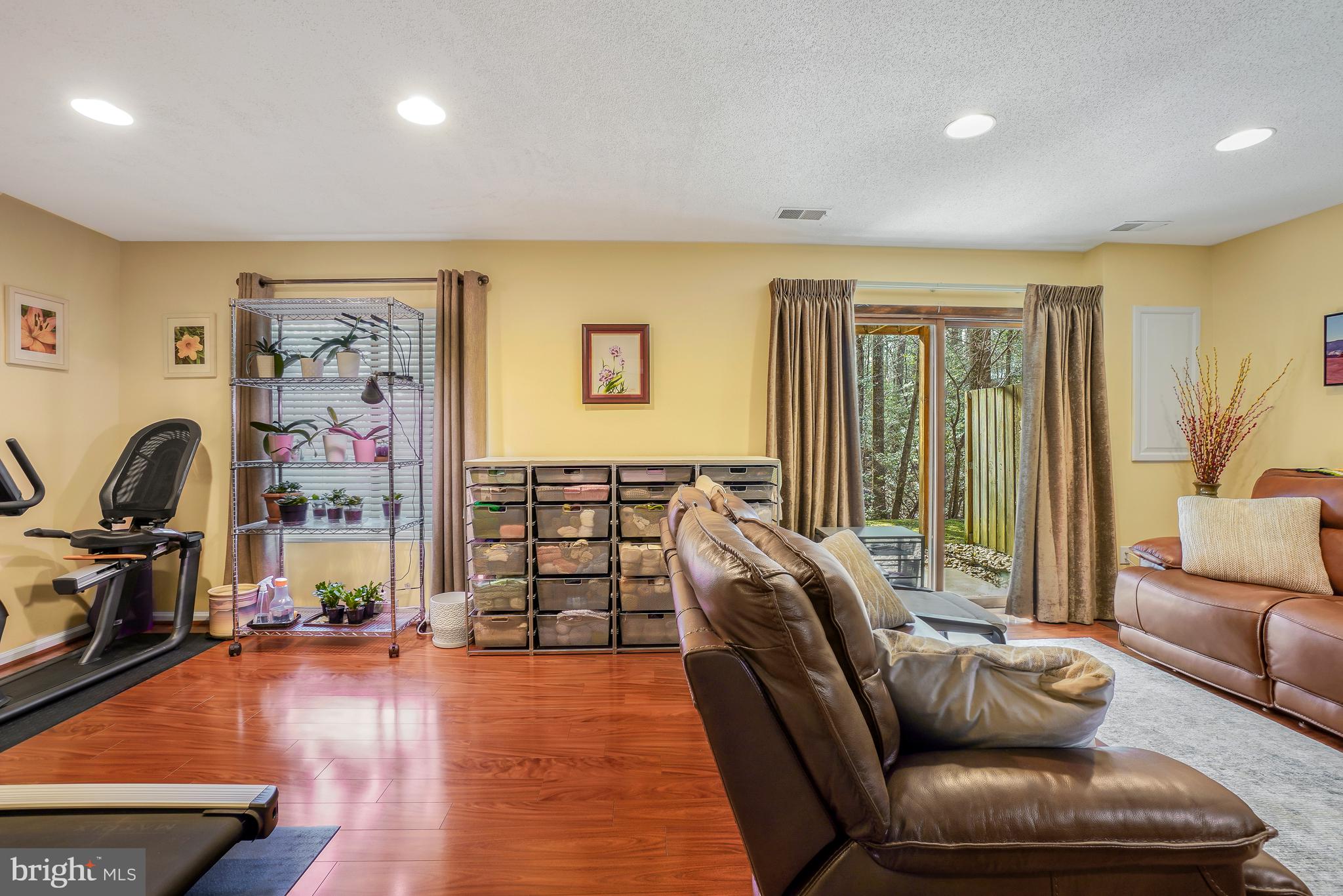 2315 Glade Bank Way Reston, VA 20191 - Photo 37 of 52 a living room with furniture and a flat screen tv