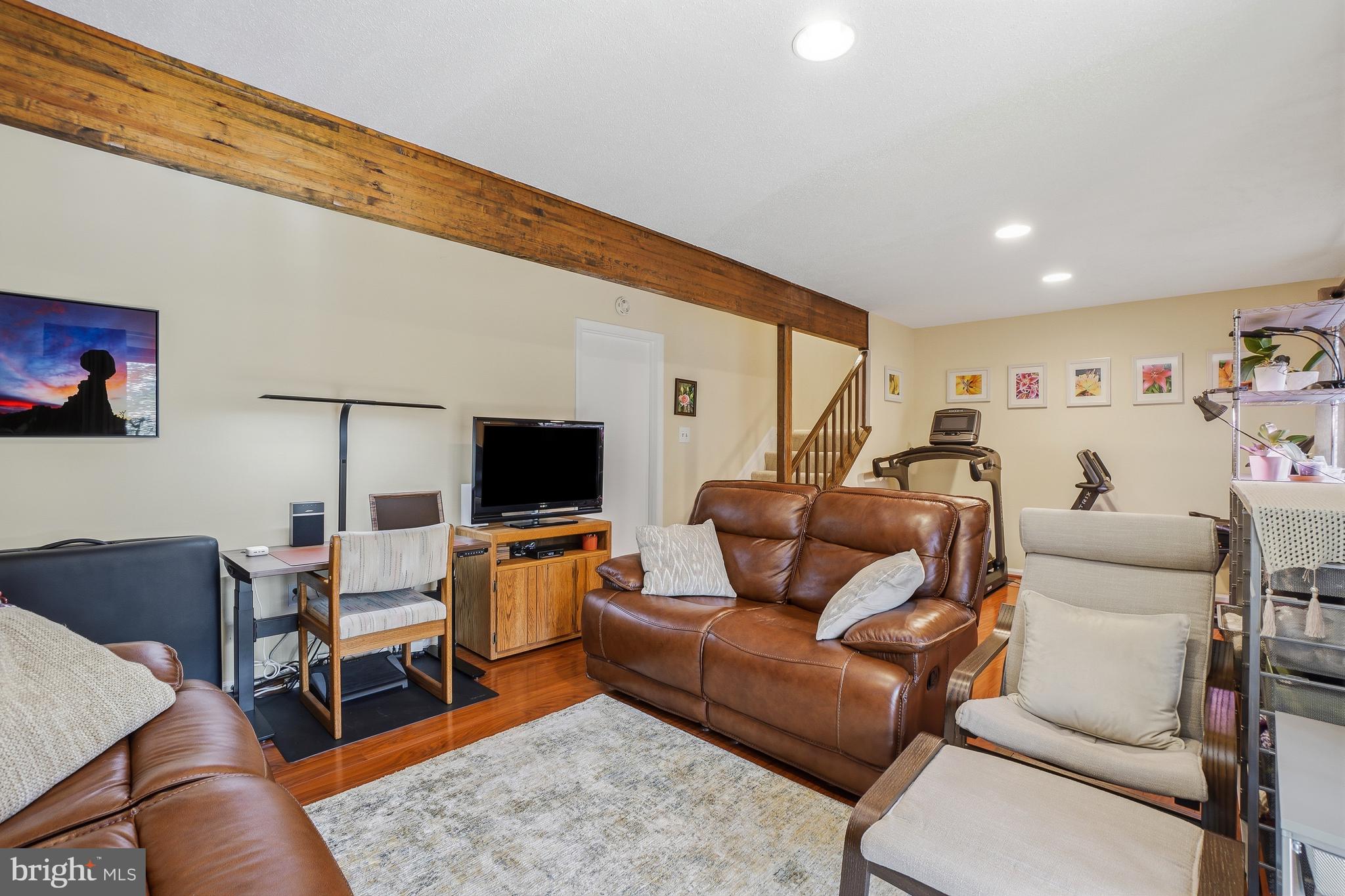 2315 Glade Bank Way Reston, VA 20191 - Photo 38 of 52 a living room with furniture and a flat screen tv
