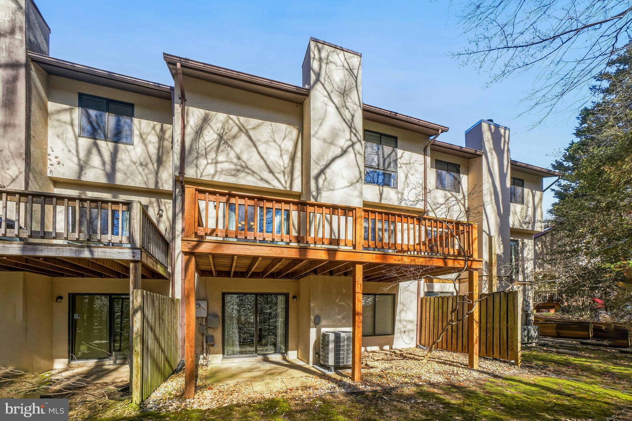 2315 Glade Bank Way Reston, VA 20191 - Photo 43 of 52 a front view of a house with a garden