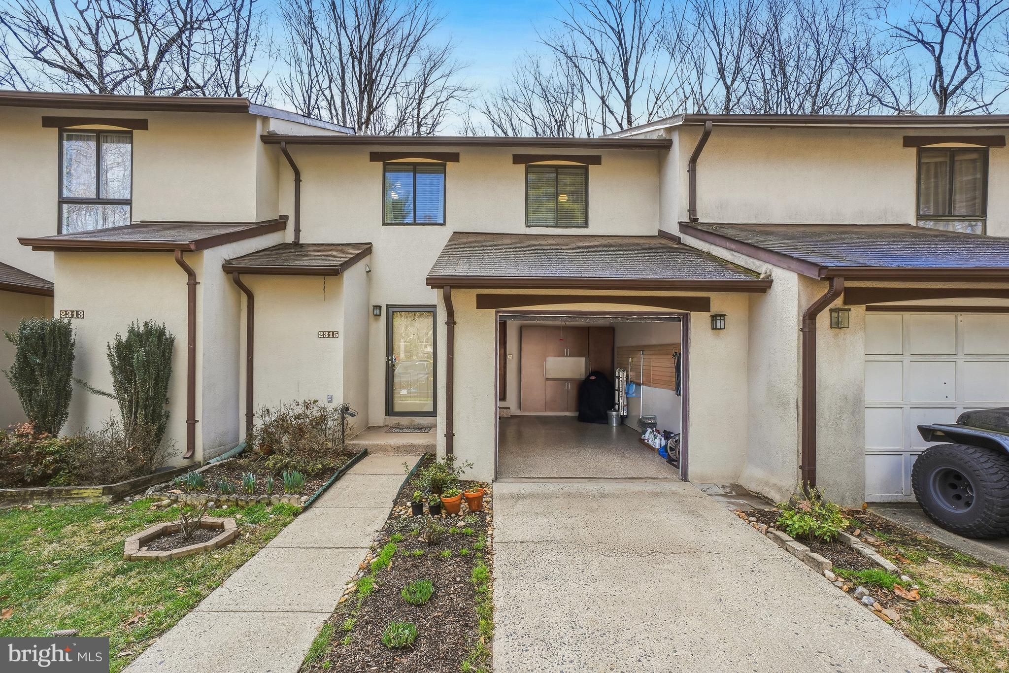 2315 Glade Bank Way Reston, VA 20191 - Photo 44 of 52 a front view of a house with a yard