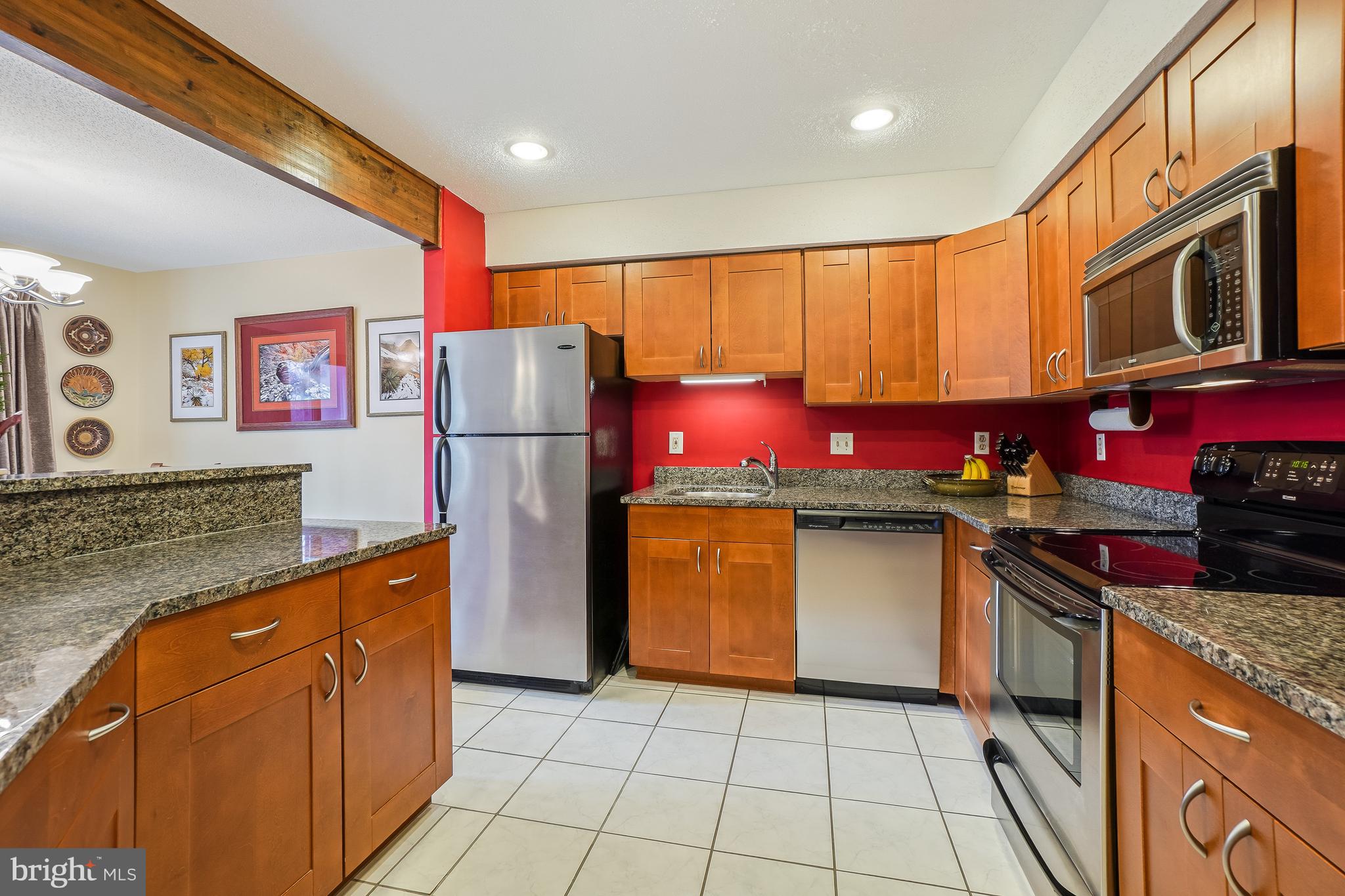 2315 Glade Bank Way Reston, VA 20191 - Photo 5 of 52 a kitchen with stainless steel appliances granite countertop a stove a refrigerator and a oven
