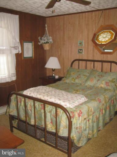 1027 Long Point Road Grasonville, MD 21638 - Photo 27 of 27 a bedroom with a bed and a window