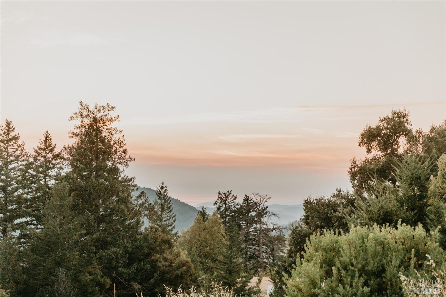 49100 Wickersham Road Geyserville, CA 95441 - Photo 19 of 98 a view of a large building with a mountain in the background