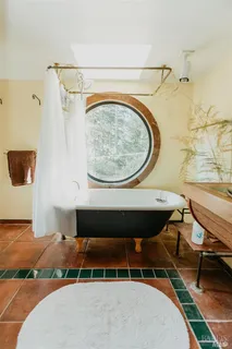 a spacious bathroom with a sink and a mirror