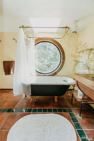 a spacious bathroom with a sink and a mirror