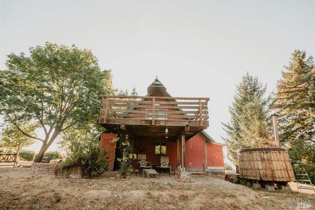 a view of a livingroom with furniture and a window