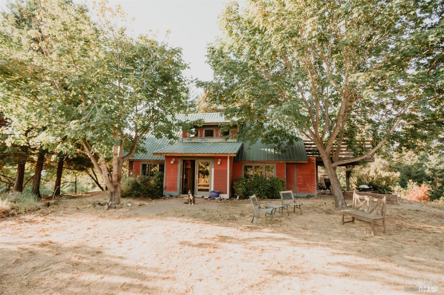 49100 Wickersham Road Geyserville, CA 95441 - Photo 43 of 98 a front view of a house with a yard