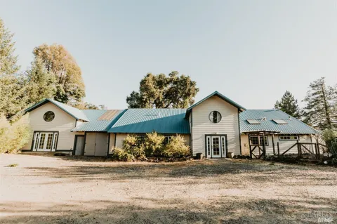 a view of balcony with wooden floor and fence