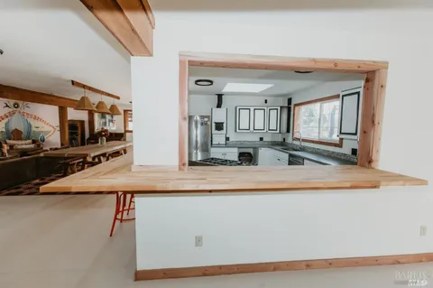 a view of a mountain in the distance in a field